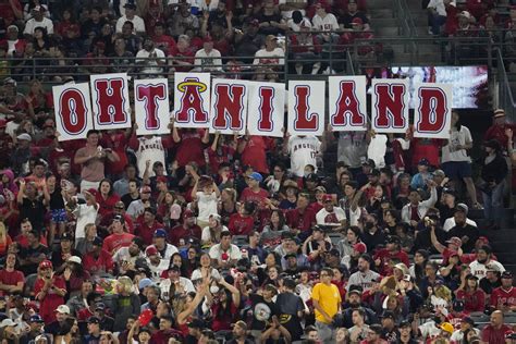Fans Hold Up A Sign In Honor Of Los Angeles Angels Designated Hitter