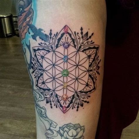 The western meaning of the lotus flower tattoo. Awesome black-ink flower of life with chakras in mandala ...