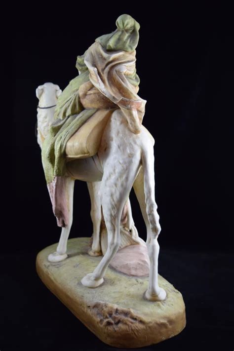 Caravans are herding camels in the desert. Sold Price: ROYAL DUX PORCELAIN OF ARAB BEDOUIN CAMEL ...