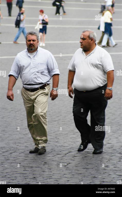 Two Fat Men Walking Stock Photo Alamy