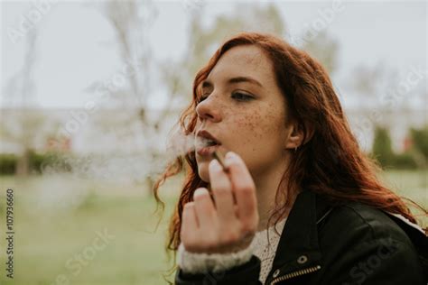 Redhead Teen Woman Smoking In The Forest Stock Photo Adobe Stock