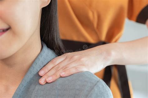 Masseur Hands Make Neck Massage For Beautiful Woman On Massage Table Stock Image Image Of