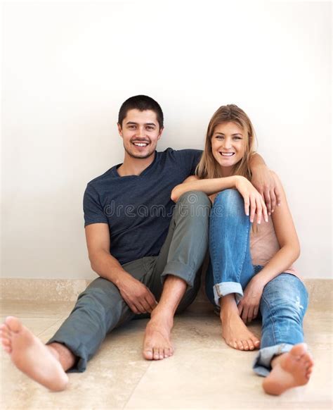 portrait smile and couple on the floor love and bonding with quality time happiness and