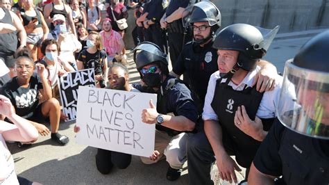 Milwaukee Police Officers Kneel Mayor Marches With Protesters