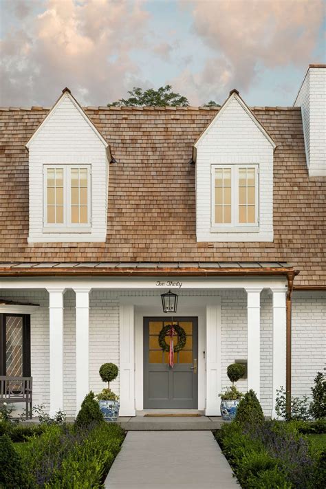 White trims serve as its saving grace as it makes the house stand out against the background. Pin by Annika Miller : SilverBox Phot on exteriors | Brick ...