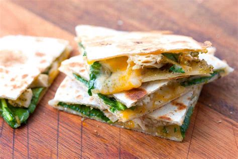 When we think of comfort food, we turn straight to melted cheese, every time. 10 Minute Pesto Chicken Quesadilla Recipe