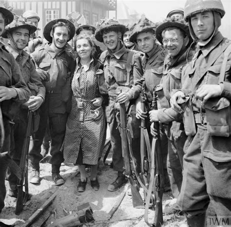 British Troops Pose For A Photograph With A French Woman Armée