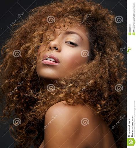 Beauty Portrait Of A Female Fashion Model With Curly Hair