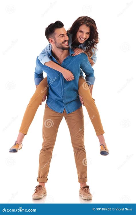 Happy Man Carrying Woman On The Back Stock Photo Image Of Holding