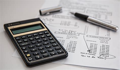 Irs has distributed 90 million stimulus payments. Black Calculator Near Ballpoint Pen on White Printed Paper · Free Stock Photo