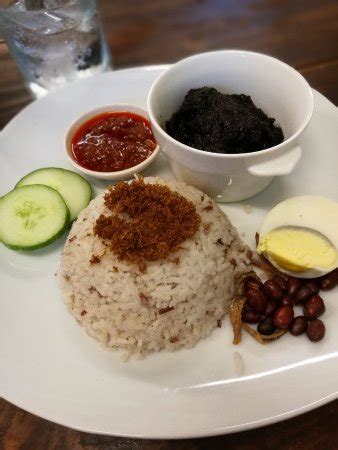 Nasi lemak is not as light and refreshing as the name suggests! nasi lemak with daging masak hitam - Picture of Indah Cafe ...