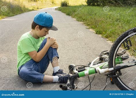 Child Fell Off Bicycle Boy Keeps Self For Bruised Knee Stock Photo