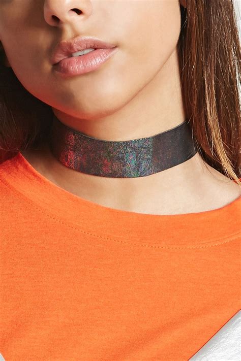 A Faux Leather Choker Featuring A Metallic Sheen And A High Polish