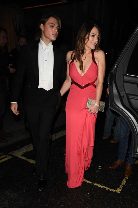 Elizabeth Hurley In A Red Dress Leaves Dame Joan Collins 88th Birthday