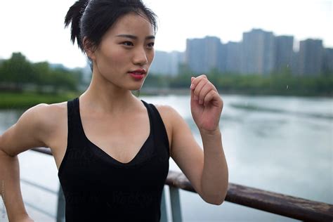 One Young Asian Woman Running Outdoor In The Park By The Lake By Stocksy Contributor Bo Bo