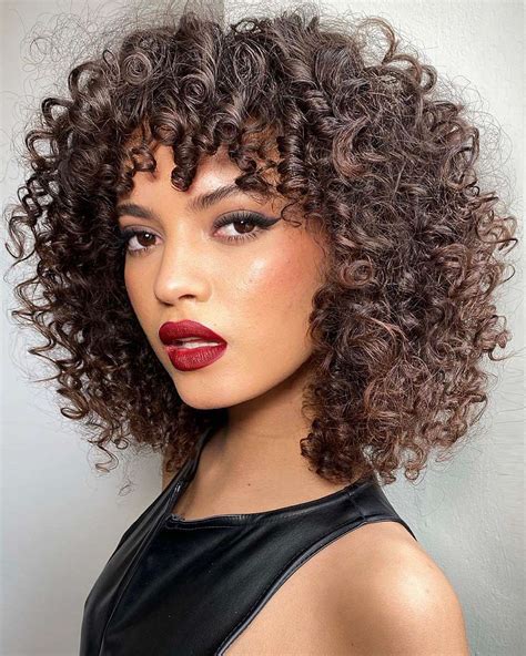 28 most popular ways to get curly hair with bangs right now