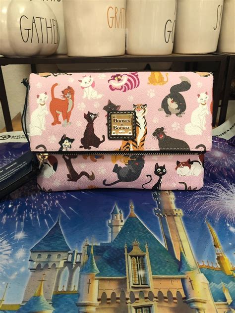 Maybe you would like to learn more about one of these? Disney Dooney & Bourke Disney Cats Foldover Crossbody ...