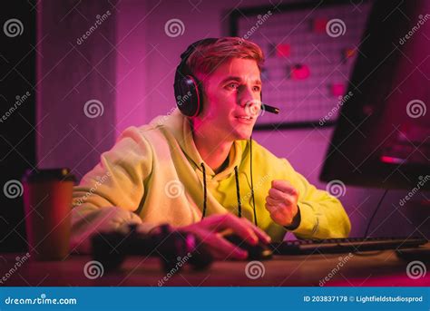 Concentrated Young Gamer In Headset Play Stock Photo Image Of Gesture