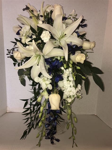 cascade bridal bouquet white oriental lilies blue delphinium white dendrobium orchids white