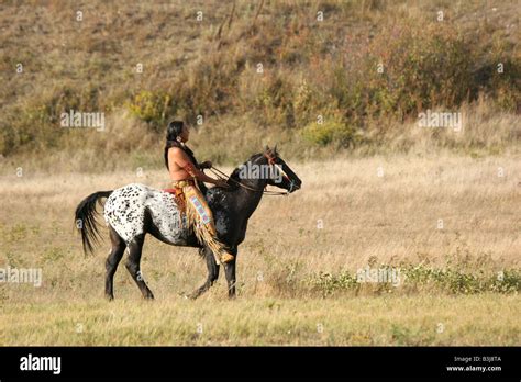 A Native American Indian On Horseback On The Reservation In South
