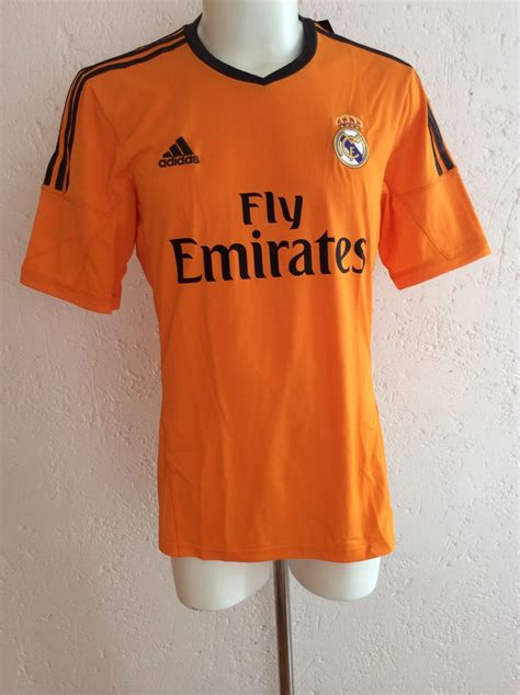 Scarce shirt, excellent condition, everything is authentic (see pictures of tags) official patches of homenaje raúl, august 2013. Jersey Real Madrid Tercer Uniforme 2014 Color Naranja Adidas - $ 579.00 en Mercado Libre