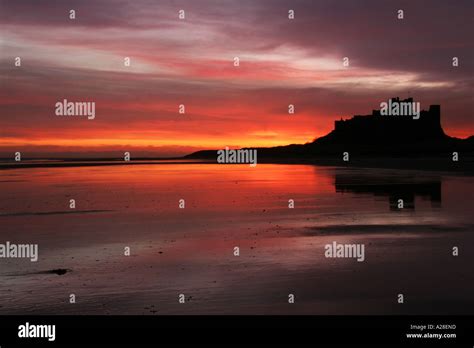 Bamburgh Castle At Sunrise In Northumberland England Uk Stock Photo Alamy