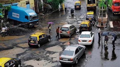 Potholes In Mumbai Woman Sustains Head Injuries After Falling Off