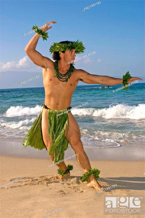 Male Hula Dancer In Ti Leaf Costume Haku Lei In A Dancing Pose On The Beach Stock Photo