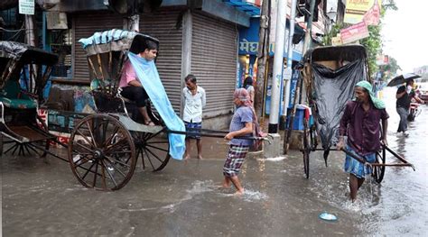 Heavy Rains In Kolkata Cause Water Logging And Traffic Snarls See Pics