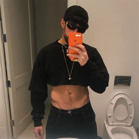 Bad Bunny Shows Off His Incredible Abs As He Poses In A Crop Top For