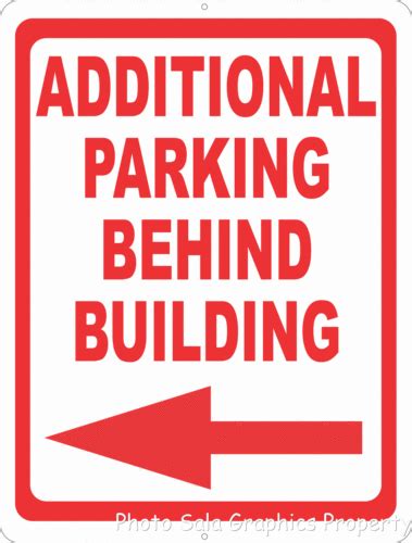 Additional Parking Behind Building Sign With Directional Arrow