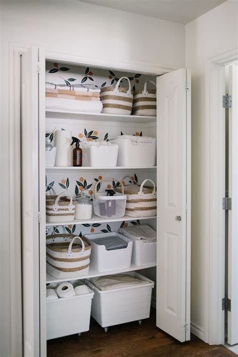 An Organized Pantry With Baskets And Containers