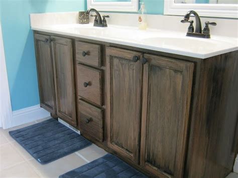 A step by step description of how to paint your oak vanity cabinets. Stain (instead of paint) builder grade oak cabinets-also ...