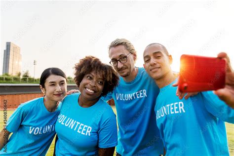 Diverse Volunteers Taking A Selfie Together Stock Photo Adobe Stock