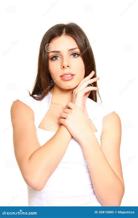 Attractive Young Woman In White Dress Posing On A White Background