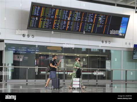 Passengers Arrive At Hong Kong International Airport In Chek Lap Kok