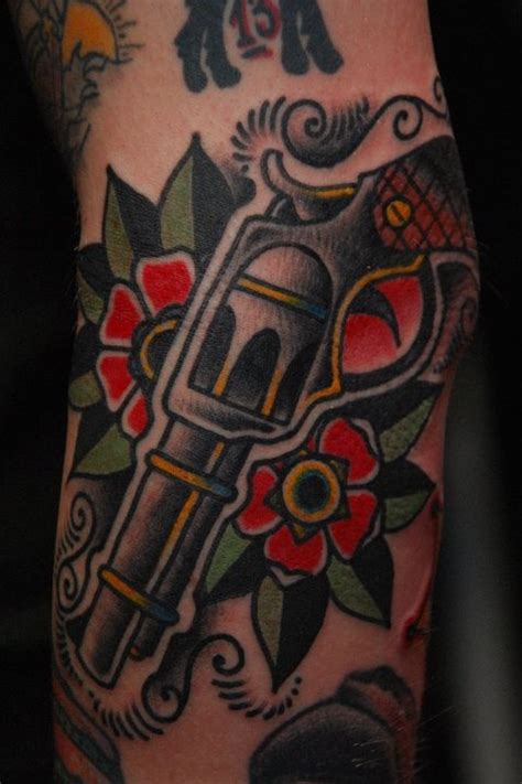 Flower And Gun American Traditional Tattoo