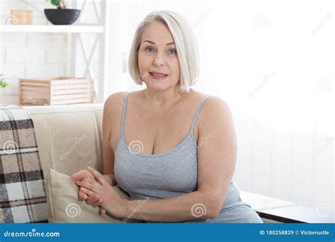 Active Beautiful Middle Aged Woman Smiling Friendly And Looking Into Camera Woman S Face Close