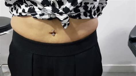 navel piercing belly button piercing in india done by ashok from mirage tattoos dwarka delhi