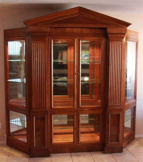 Features adjustable glass shelves, interior lighting, drawer storage and open lower shelf. Six-piece lighted curio cabinet. | Curio cabinet, Cabinet ...