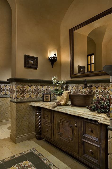 Italian Villa Bathroom With A Rustic Metal Vessel Sink In Front Of The