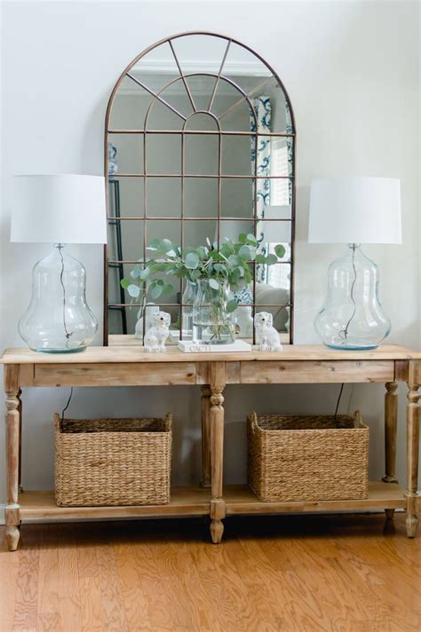 A Pair Of Vintage Glass Lamps In The Entry Foyer Table Decor