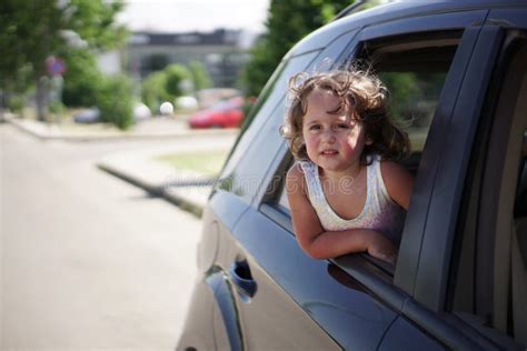Little Girl Looking Out Of The Car Window Stock Photo Image Of