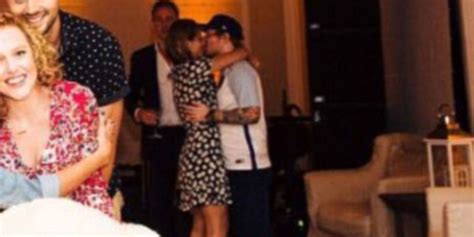 Look Ed Sheerans Photobombed Taylor Swift By Smooching His Girlfriend Cherry Seaborn
