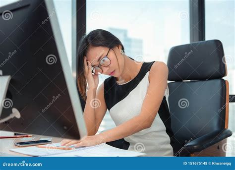 Portrait Of Businesswoman Having Exhausted Tired And Headache While