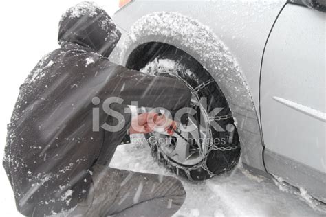 Putting On Snow Chains Stock Photo Royalty Free Freeimages
