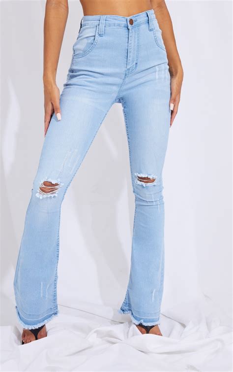 Light Blue Wash Distressed Knee Flare Jeans Prettylittlething Ie