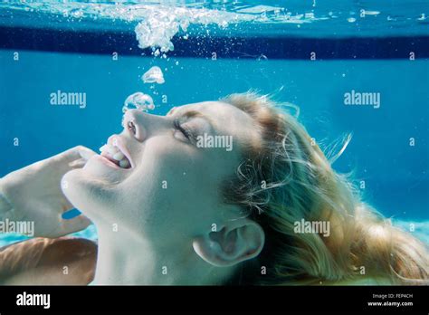 Beautiful Woman Swimming Underwater In Pool Female Swimmer In Bikini