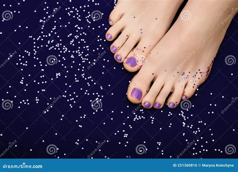 Female Feet With Purple Pedicure Woman Legs With Glitter Purple Nail