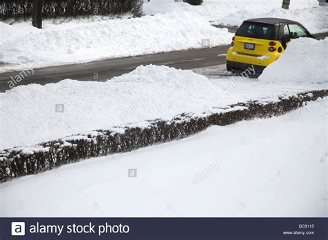 Yellow Car On Snowy Road Stock Photo Alamy